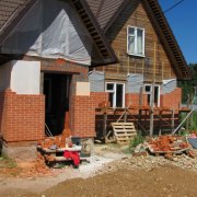 Facing a wooden house with a brick: we perform competently