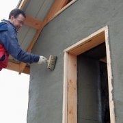 Stucco of the facade of the house, as a way of decorating it and extending the service life