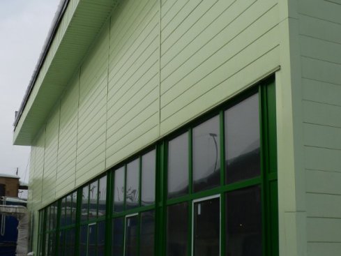 Facing the exterior walls of the building with aluminum siding