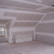 How is plasterboard wall covering performed