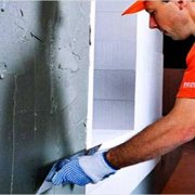 How is stucco wall plastering done