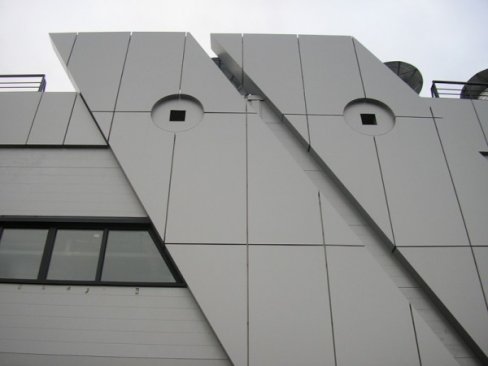 Facade cladding with composite aluminum panels