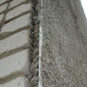 How is plastering external walls