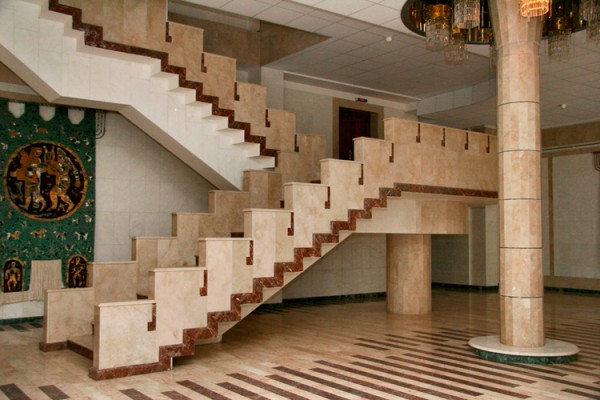 The lobby and staircase are faced with marble.