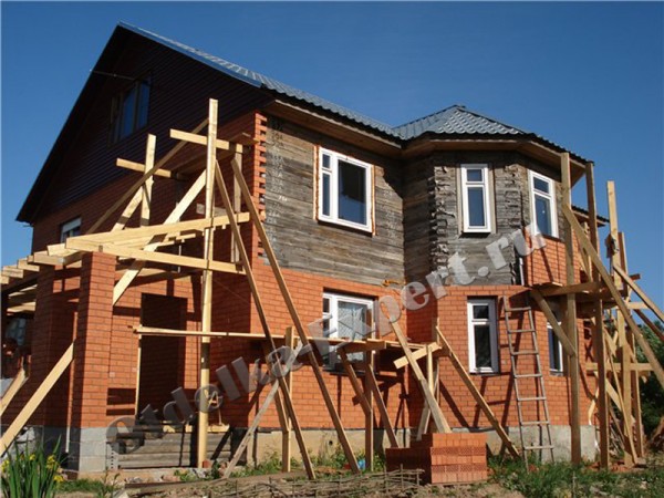 The wooden structure is covered with decorative bricks.