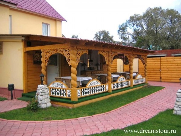 Exterior finish: wooden porch with carved elements