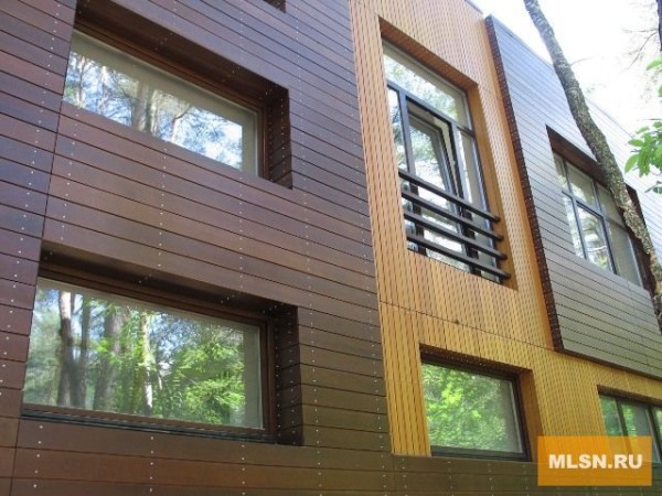 Design of the cladding of the house with wood siding: facade