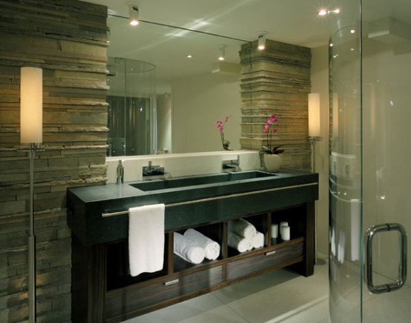 Stone columns in the bathroom, framing and supporting the mirror design miracle