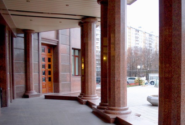 Multifaceted columns with granite cladding