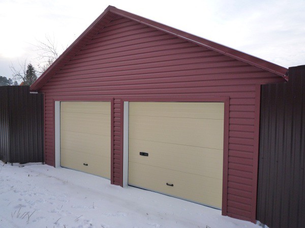 Facade of a garage faced with siding