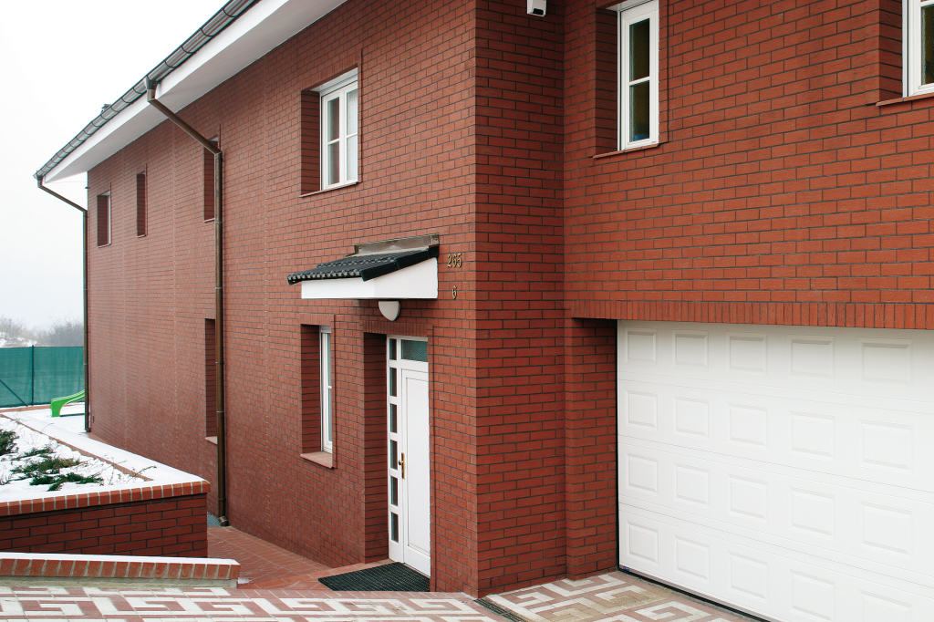 The facade of the house, faced with brick tiles