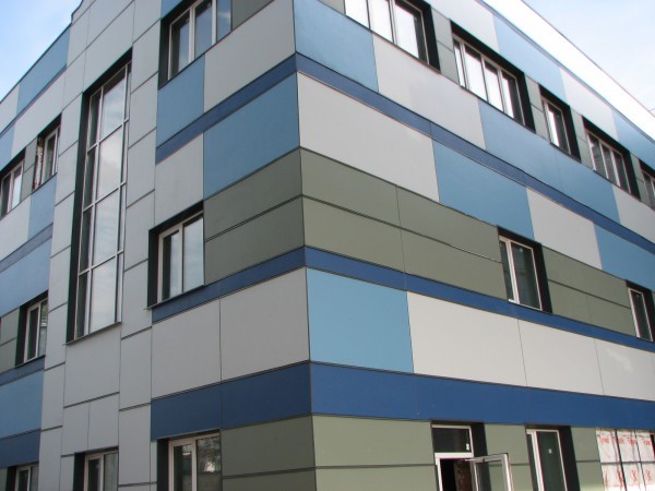 Facing facades with fiber cement panels