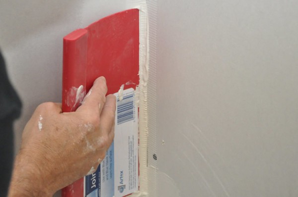 Rubber spatula is indispensable for sealing joints in hard to reach places