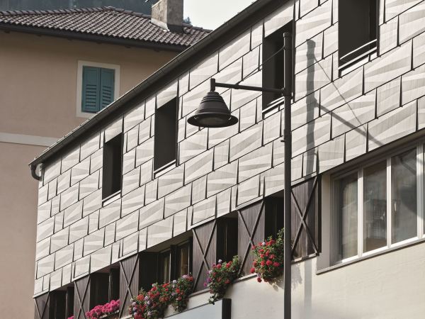 Facing metal panels in facade design