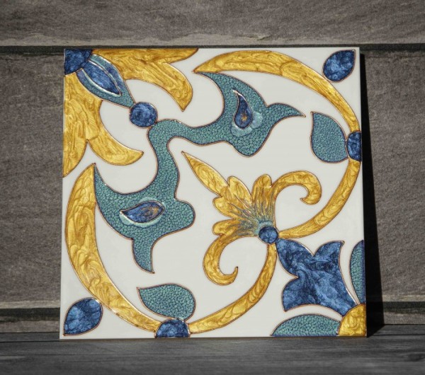 In the photo, a tile painted with stained-glass paints without firing