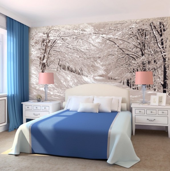 Wall mural winter forest in bedroom interior