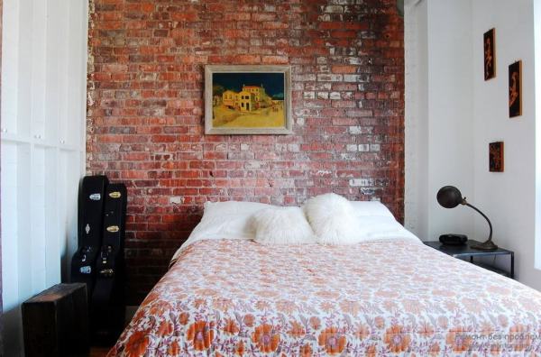 Wallpaper imitating a brick in a bedroom