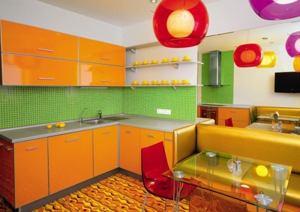 Orange kitchen with light walls and a light green apron