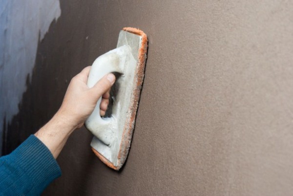 Methods of plastering walls