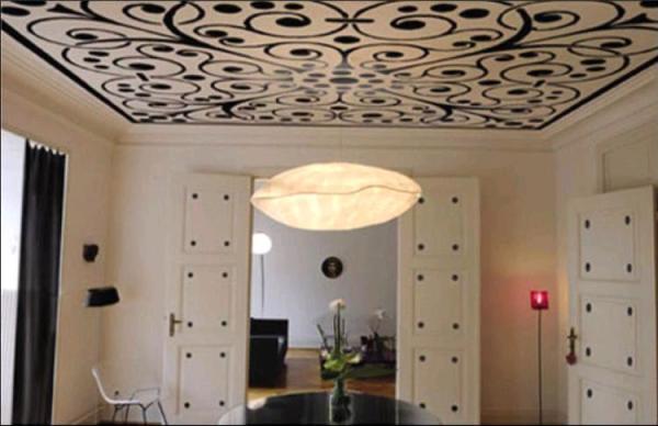 Light with a dark pattern wallpaper on the ceiling