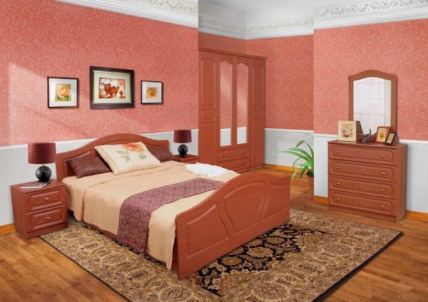 Brown furniture on a background of pink and white wallpaper