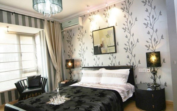 The photo shows dark furniture and light wallpaper