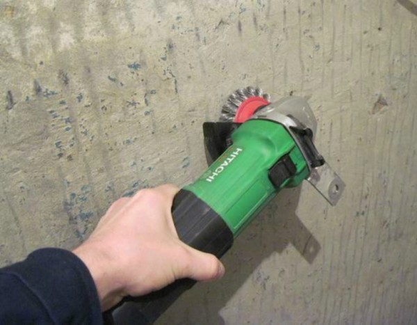 Removing paint with a cord brush mounted on an electric drill