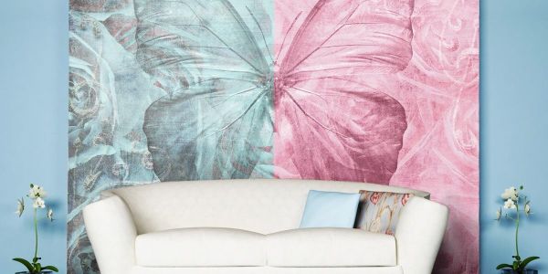 Spectacular two-color photo wallpaper with the image of a butterfly on a background of roses, in the interior of the living room