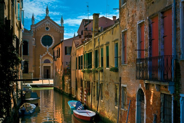 Wall mural with the image of Venice street with 3D effect