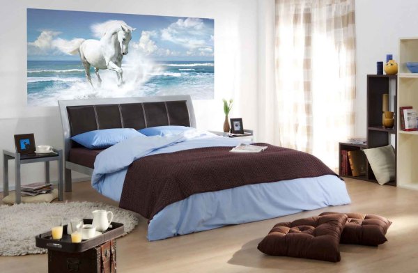 Horse on the background of the sea in the bedroom interior