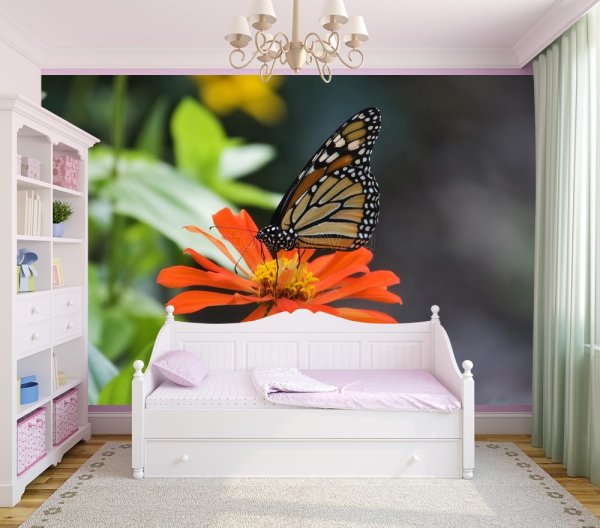 In the photo, photo wallpaper with a butterfly on a flower, in the interior of the girl’s room