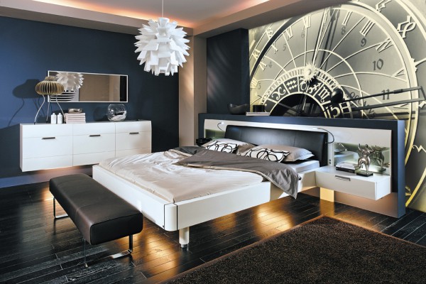 Original mural with black and white clock dial in bedroom interior