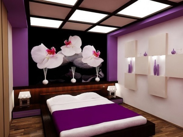 Wall mural with delicate orchids in the modern bedroom interior