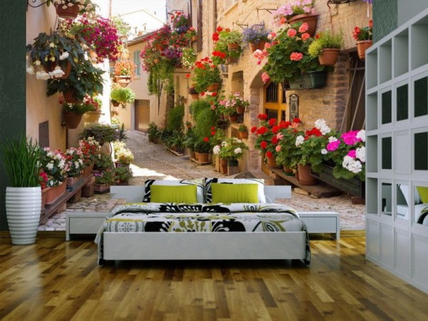 Wall mural with colorful street garden in bedroom interior