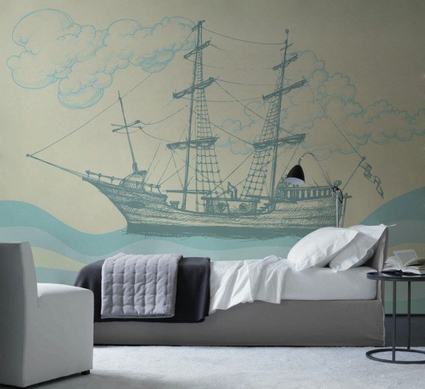 Wall mural with the image of a painted ship in the interior of a young guy