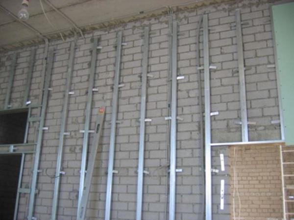 Fastening the profile to the wall under the drywall