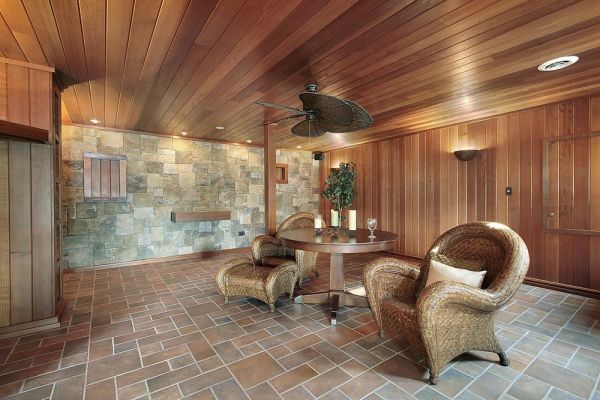 Rustic living room, sewn up with wooden paneling, treated with special impregnations that completely changed the color of the tree