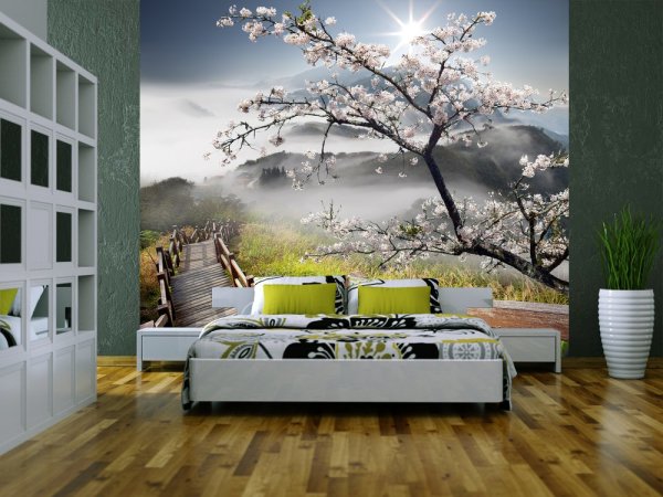 An example of using photo wallpaper with a remote image of mountains to highlight a sleeping area in a bedroom