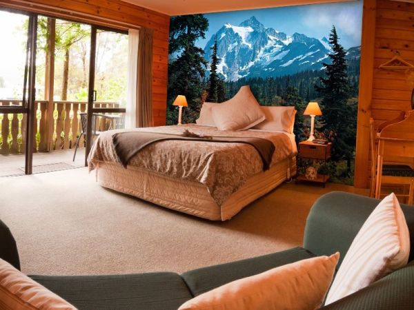 Morning in the forest in the mountains fits perfectly into the interior of the bedroom trimmed with wood