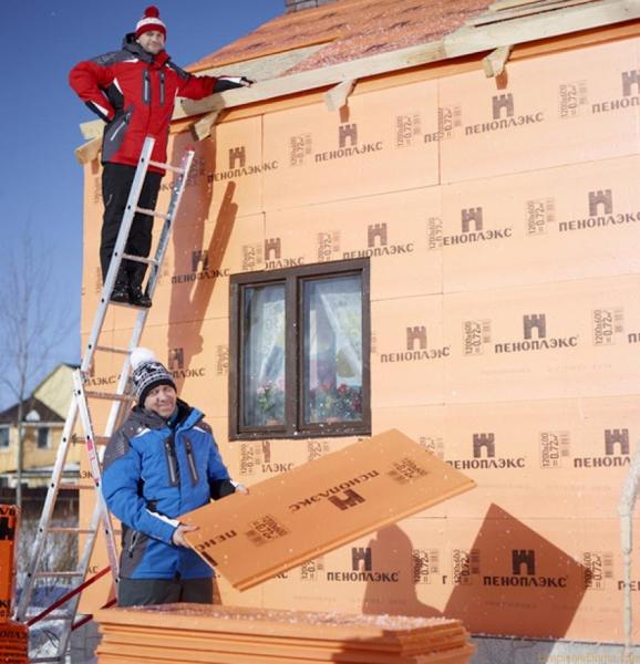 The facade of a private house, insulated with foam crest plates