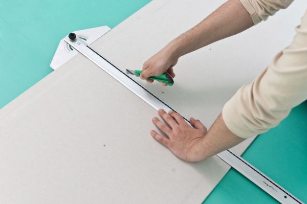 Drywall sheets need to be immediately measured and cut into necessary pieces