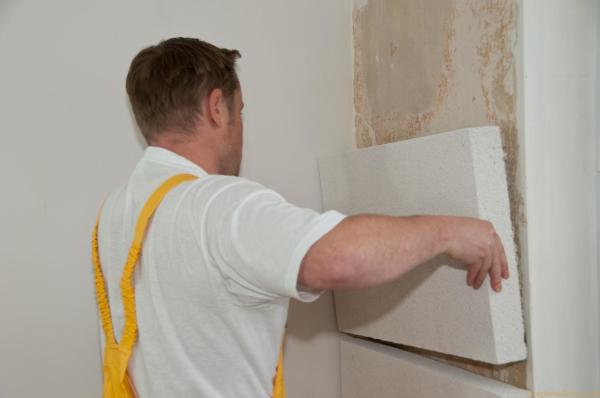 Installation of insulation boards on pre-prepared walls