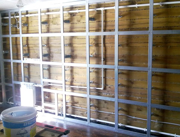 Mounting drywall on the walls with the help of a crate, allows you to hide pipes and other home communications under it