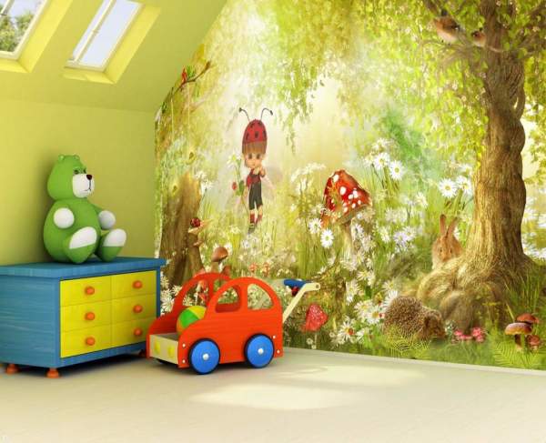 The photo shows the interior of the children's room, decorated with murals depicting a light forest along which the baby walks and watches the animals