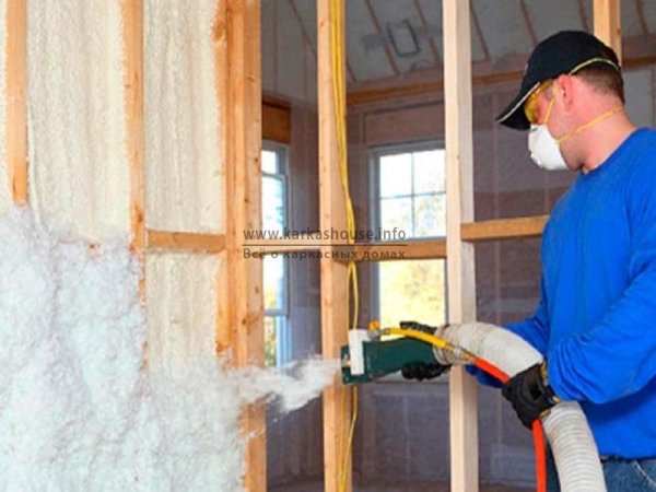 In the photo, the specialist applies polyurethane foam on a wooden partition