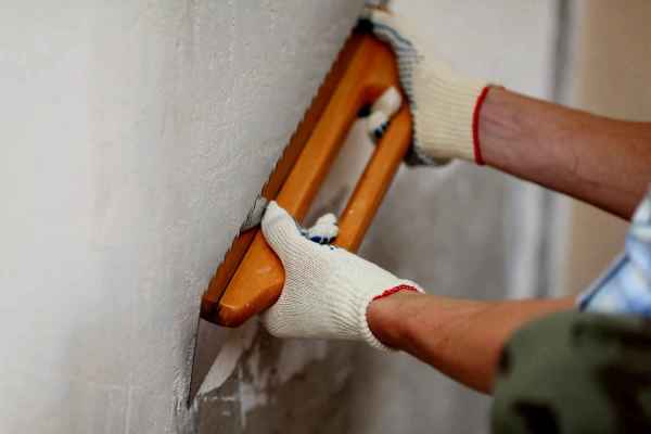 The process of leveling the walls before applying mdf wall panels to them