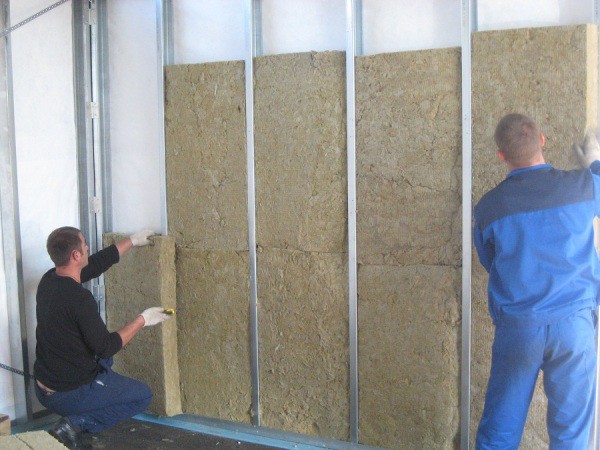 Wall insulation with basalt wool, which differs from wool with mineral gray color and a denser structure