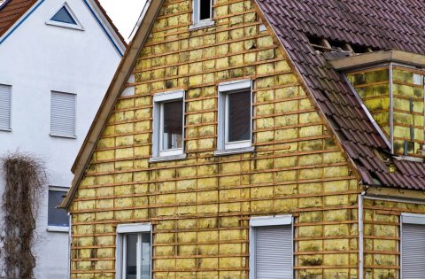 We see the insulated walls of the house with mineral wool