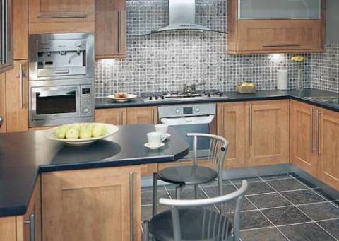 In the photo we see an example of how to decorate the walls in the kitchen with a tile