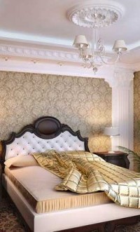 The stucco molding located at the corners favorably sets off the wallpaper